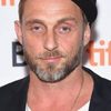 Roland Marko Simmonds as Cop