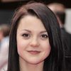 Kathryn Prescott as Zoe