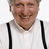 Tom Baker as The Fourth Doctor (archive footage)