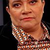 Carmen Ramos as Regis (voice)