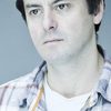 Dominic Rowan as Reporter 2