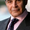 David Suchet as Mr. Ruskin