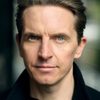 Oliver Ryan as Bookshop Assistant