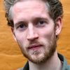 Mads Reuther as Aksel Skov
