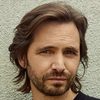 Aaron Stanford as Oscar Grubman
