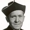 James Bell as Father Logan