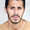 Mounir Margoum as Ahmed, the Islamist