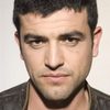 Amos Tamam as Simon Hasson