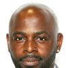 Alimi Ballard as The Curious Assassin