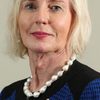 Catherine McGregor as Janice
