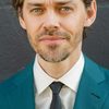 Tom Payne as Elon