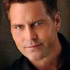 Eric Scott Woods as Father John