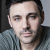 Liam Garrigan as Reggie Nigri