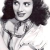 Adriana Caselotti as First Peasant Girl (uncredited)