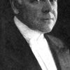 Edward McWade as The Prison Doctor