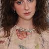 Emily Fairn as Bella Holmes