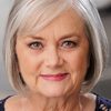 Debbi Tucker as Church parishioner