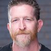Andy Mackenzie as The Voice