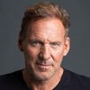 Ralf Moeller as Warden Arnold Calgrove