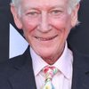 Shaun Scott as Father Carol