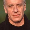 Marc de Jonge as Le patron de Karamazov