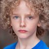 Elijah Wolf as Tommy (aged 9)