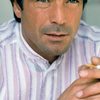 Maurice Poli as TV Newscaster