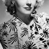 Ona Munson as Kitty Carmody
