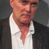 Stuart Milligan as Greenfield