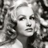 Julie Newmar as Miss Kitty