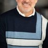 Ian James Corlett as Captain Candy (voice)