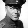 G. Pat Collins as Patrolman Johnson