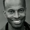 Denis Simpson as Abo Shaman / Choreographer