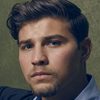 Luke Bilyk as John Servinis
