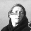 Maggie Dirrane as His Wife