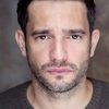 Chris Brazier as Tom (uncredited)