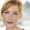 Karen Strassman as Reporter Sarah James
