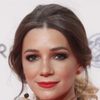 Micaela Breque as Carina
