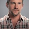 Zachary Knighton as Travis