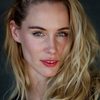 Sayla de Goede as AirHadida Flight Attendant