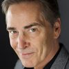 Martin Thompson as Police Interrogator
