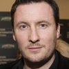 Gavin O'Connor as John McCarthy