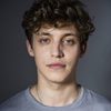 Sebastian Dela as Adrian