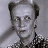 Olive Carey as Mrs. Brent