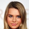 Indiana Evans as Naomi Tate