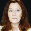 Carla Mancini as Woman reading a book