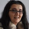 Adriana Macsut as Parishioner