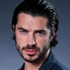 Samuel Robertson as Tommy Gun