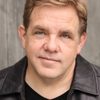 Brian Howe as Randy Scheunemann