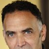 Tom Hale as record executive on cellular phone